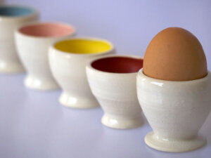 Coloured egg cups handmade by Corinna Pyman