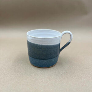 Stoneware mug with blue and white glaze